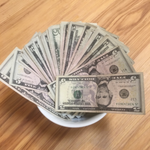 Pouring Kindness from a Bowl of Cash